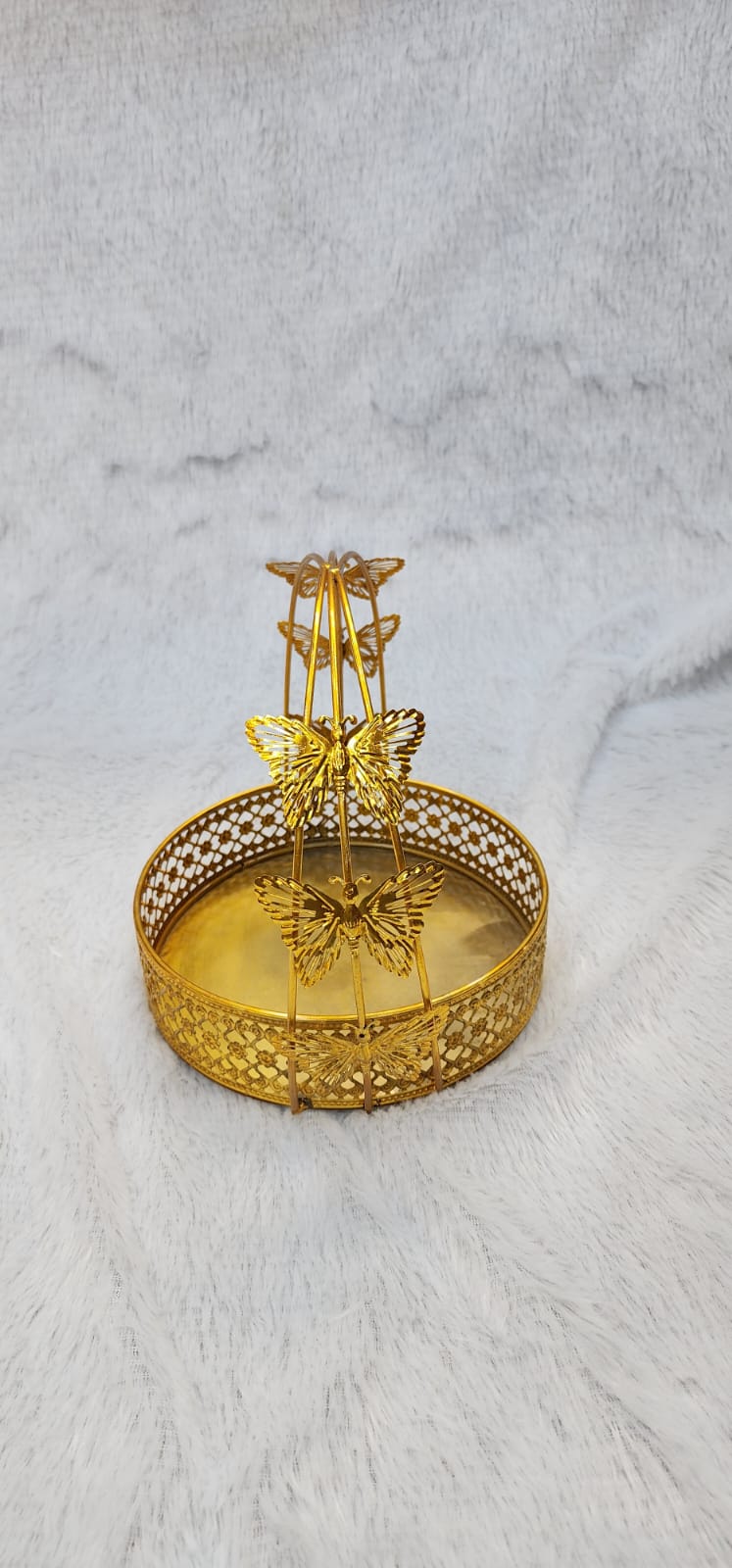 Golden metal gift hamper basket with a butterfly design.
